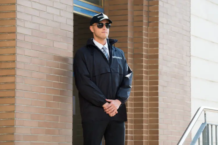 Guard Standing Outside A Building